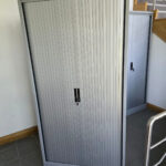 Used metal tambour door cupboards