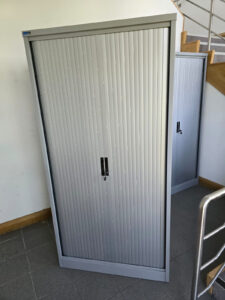 Used metal tambour door cupboards