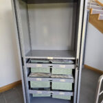 Used metal tambour door cupboards