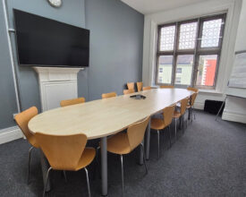 Used meeting table with 16 chairs