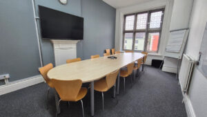 Used meeting table with 16 chairs